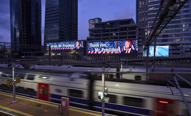 An electronic billboard beams an image of President Donald Trump alongside the message "Thank you, Mr. President" referring to the U.S. involvement in the war between Israel and Iran, in Ramat Gan, Israel, Sunday, June 22, 2025. (AP Photo/Bernat Armangue)