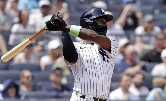 New York Yankees' Jazz Chisholm Jr. hits a three-run triple during the third inning of a baseball game against the Athletics, Sunday, June 29, 2025, in New York. (AP Photo/Adam Hunger)