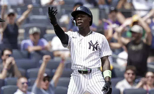 New York Yankees' Jazz Chisholm Jr. reacts after hitting a three-run scoring triple during the third inning of a baseball game against the Athletics, Sunday, June 29, 2025, in New York. (AP Photo/Adam Hunger)