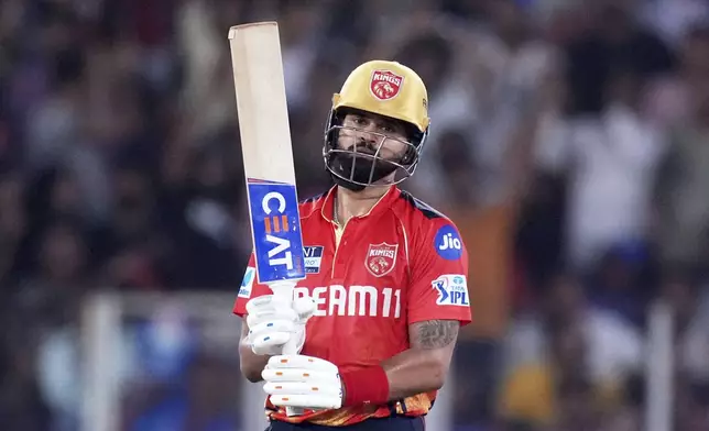 Punjab Kings' captain Shreyas Iyer celebrates after scoring fifty runs during the Indian Premier League cricket match between Punjab Kings and Mumbai Indians at Narendra Modi Stadium in Ahmedabad, India, Monday, June 2, 2025. (AP Photo/Ajit Solanki)