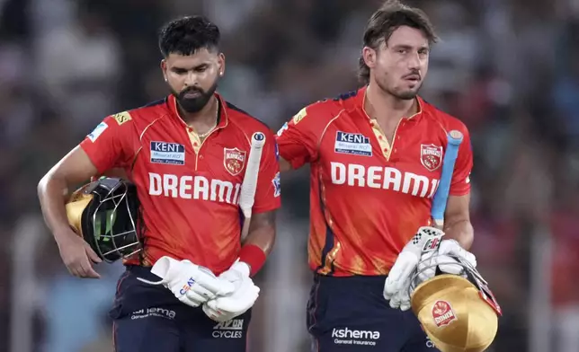 Punjab Kings' captain Shreyas Iyer, left, and teammate Marcus Stoinis leave after winning the Indian Premier League cricket match against Mumbai Indians at Narendra Modi Stadium in Ahmedabad, India, Monday, June 2, 2025. (AP Photo/Ajit Solanki)