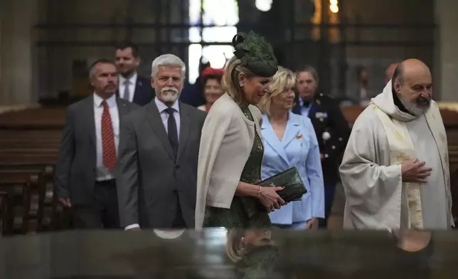 Queen Maxima of The Netherlands, center, and Czech Republic's President Petr Pavel with his wife Eva Pavlova arrive for a blessing ceremony for a bell that was made from weapons used in Ukraine's war, in Prague, Czech Republic, Thursday, June 5, 2025. (AP Photo/Petr David Josek)