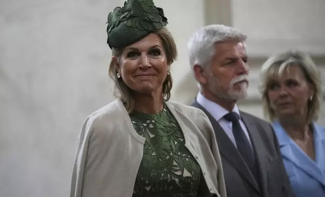 Queen Maxima of The Netherlands, left, and Czech Republic's President Petr Pavel with his wife Eva Pavlova, attend a blessing ceremony for a bell that was made from weapons used in Ukraine's war, in Prague, Czech Republic, Thursday, June 5, 2025. (AP Photo/Petr David Josek)