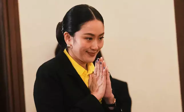 Thailand's Prime Minister Paetongtarn Shinawatra arrives to talk to reporters at Government house in Bangkok, Thailand, Thursday, June 19, 2025. (AP Photo/Sakchai Lalit)