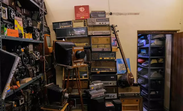 Old cameras, vintage radios and typewriters are stacked in racks in the house of Aditya Vij, an Indian anthropologist and an avid collector of artifacts, in New Delhi, India, April 18, 2025. (AP Photo/Manish Swarup)
