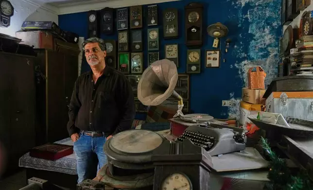 Aditya Vij, an Indian anthropologist and an avid collector of artifacts, poses for a photograph at his house in New Delhi, India, April 18, 2025. (AP Photo/Manish Swarup)