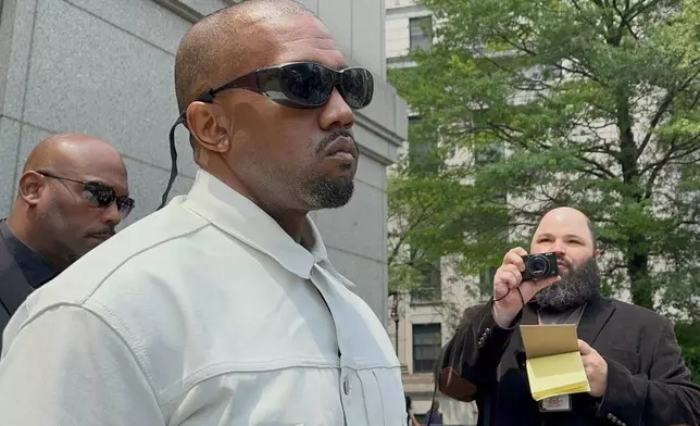 Ye, the rapper formerly known as Kanye West, leaves federal court during the trial of Sean "Diddy" Combs in New York, Friday, June 13, 2025. (AP Photo/Larry Neumeister)