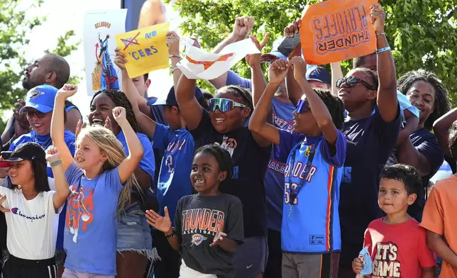 Fans cheer before Game 7 of the NBA Finals basketball series between the Indiana Pacers and the Oklahoma City Thunder Sunday, June 22, 2025, in Oklahoma City. (AP Photo/Kyle Phillips)