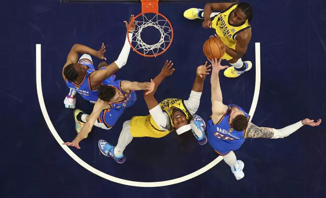 Indiana Pacers center Myles Turner (33) drives to the basket against Oklahoma City Thunder forward Chet Holmgren (7) during the first half of Game 6 of the NBA Finals basketball series, Thursday, June 19, 2025, in Indianapolis. (Maddie Meyer/Pool Photo via AP)