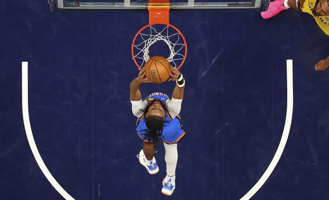 Oklahoma City Thunder guard Isaiah Joe dunks against the Indiana Pacers during the second half of Game 6 of the NBA Finals basketball series, Thursday, June 19, 2025, in Indianapolis. (Maddie Meyer/Pool Photo via AP)