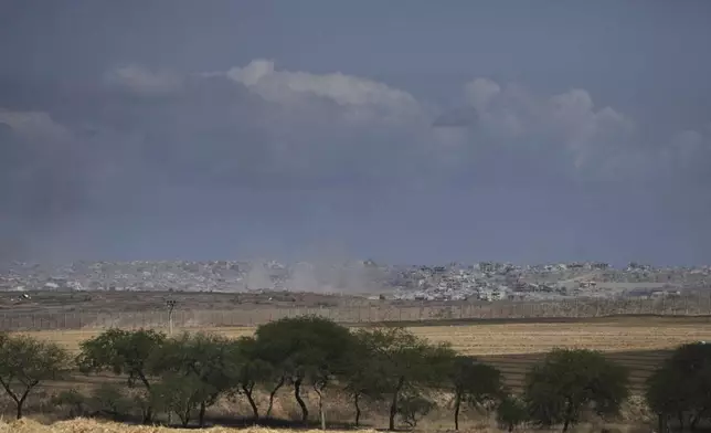 Smoke from Israeli bombardment rises over buildings in the northern Gaza Strip, seen from southern Israel, Monday, June 2, 2025. (AP Photo/Maya Alleruzzo)