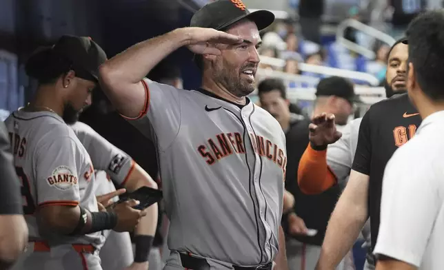 San Francisco Giants starting pitcher Robbie Ray walks in the dugout after being relieved during the eighth inning of a baseball game against the Miami Marlins, Saturday, May 31, 2025, in Miami. (AP Photo/Lynne Sladky)