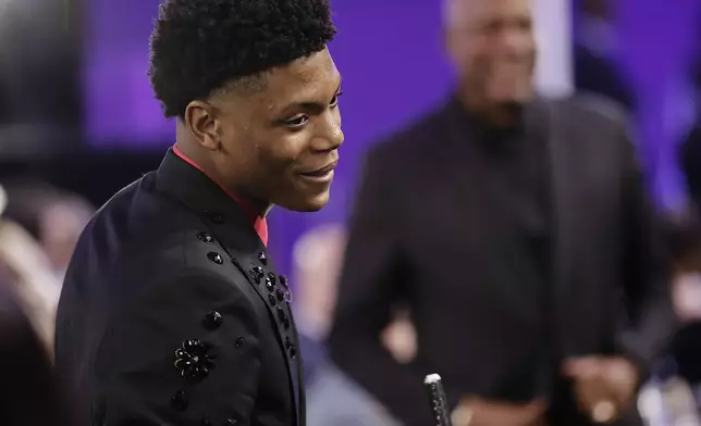 Ace Bailey reacts after being selected fifth by the Utah Jazz in the first round of the NBA basketball draft, Wednesday, June 25, 2025, in New York. (AP Photo/Adam Hunger)
