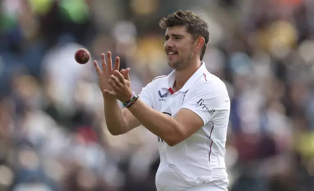 England's Josh Tongue prepares to bowl on day four of the first cricket test match between England and India at Headingley in Leeds, England, Monday, June 23, 2025. (AP Photo/Scott Heppell)