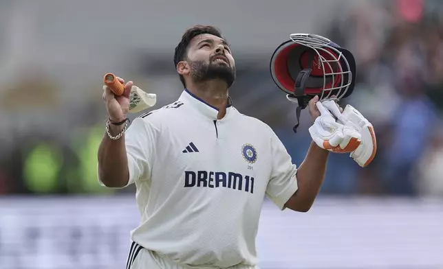 India's Rishabh Pant celebrates after scoring a century on day four of the first cricket test match between England and India at Headingley in Leeds, England, Monday, June 23, 2025. (AP Photo/Scott Heppell)