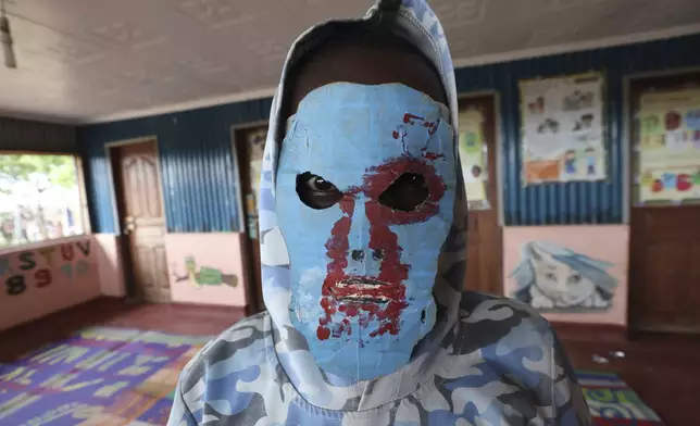 A young refugee child from the Robot Boys group practices robot dance at a Child-Friendly Space in the Kalobeyei Refugee Settlement in Turkana, Kenya, Monday, June 2, 2025. (AP Photo/Andrew Kasuku)