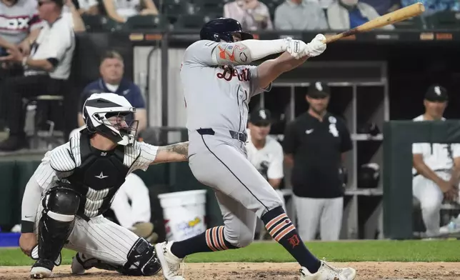 Detroit Tigers's Kerry Carpenter hits a solo home run during the sixth inning of a baseball game against the Chicago White Sox in Chicago, Monday, June 2, 2025. (AP Photo/Nam Y. Huh)