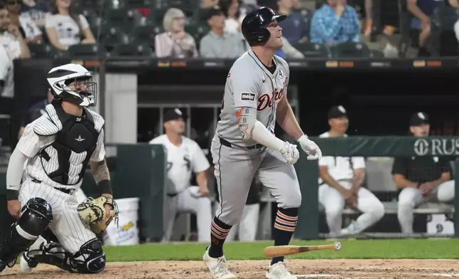Detroit Tigers's Kerry Carpenter watches after hitting a solo home run during the sixth inning of a baseball game against the Chicago White Sox in Chicago, Monday, June 2, 2025. (AP Photo/Nam Y. Huh)