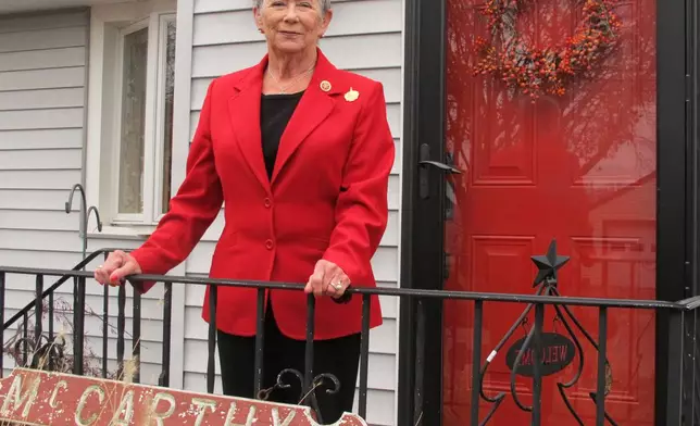 FILE - U.S. Rep Carolyn McCarthy, D-NY, poses for a photo outside her home in Mineola, N.Y., Dec. 2, 2014. (AP Photo/Frank Eltma, File)