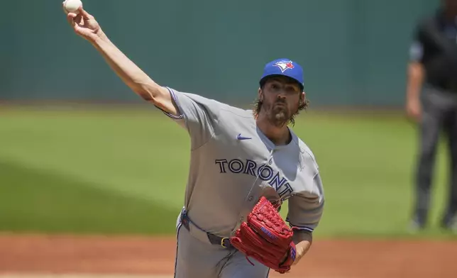 Toronto Blue Jays' Kevin Gausman pitches in the first inning of a baseball game against the Cleveland Guardians in Cleveland, Thursday, June 26, 2025. (AP Photo/Sue Ogrocki)