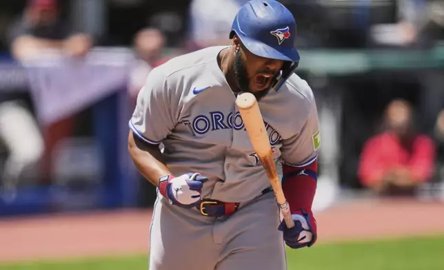 Toronto Blue Jays' Vladimir Guerrero Jr. reacts after being hit by a pitch in the third inning of a baseball game against the Cleveland Guardians in Cleveland, Thursday, June 26, 2025. (AP Photo/Sue Ogrocki)