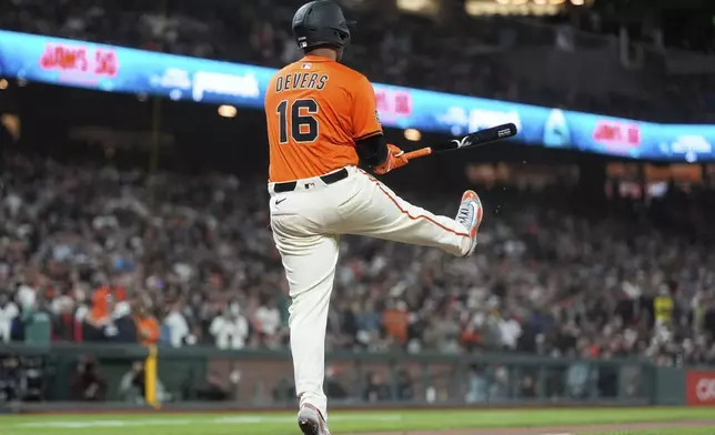 San Francisco Giants' Rafael Devers (16) reacts after striking out against the Boston Red Sox during the ninth inning of a baseball game in San Francisco, Friday, June 20, 2025. (AP Photo/Jeff Chiu)