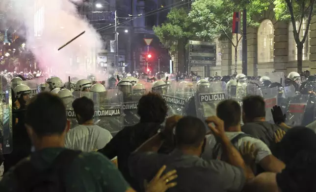 Riot police block anti-government protesters at the end of a rally pressing for an early election after nearly eight months of almost daily anti-corruption demonstrations that have shaken the populist government of President Aleksandar Vucic, in Belgrade, Serbia, Saturday, June 28, 2025. (AP Photo/Marko Drobnjakovic)