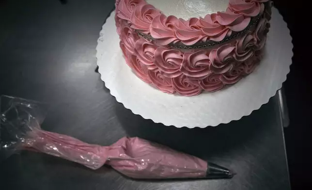 A piping bag lays next to a cake inside Walmart Supercenter on Wednesday, May 28, 2025, in North Bergen, N.J. (AP Photo/Andres Kudacki)