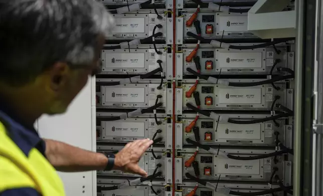 Craig Horne, senior vice president of advanced energy solutions for Energy Vault, a company that is creating an emergency power system that relies on hydrogen and battery storage, shows a battery system Tuesday, May 27, 2025, in Calistoga, Calif. (AP Photo/Annika Hammerschlag)