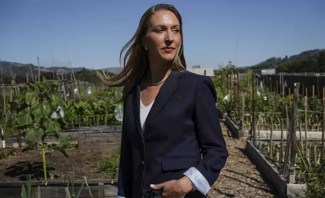 Calistoga resident and City Council member Lisa Gift poses for a portrait Tuesday, May 27, 2025, at the community garden in Calistoga, Calif. (AP Photo/Annika Hammerschlag)
