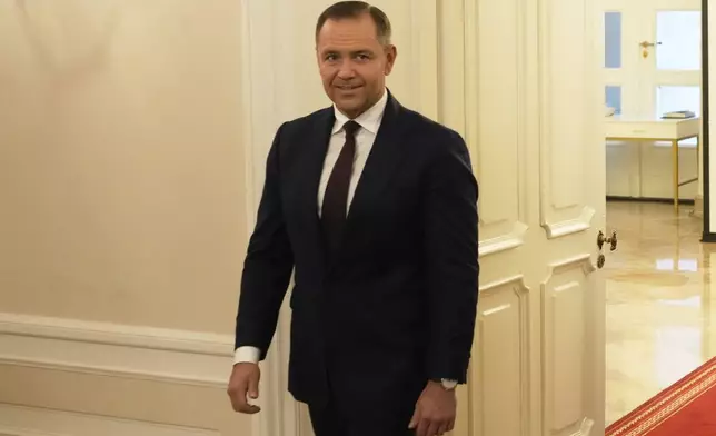 Poland's President Elect Karol Nawrocki arrives to meet with Poland's outgoing President Andrzej Duda at the Presidential Palace in Warsaw, Poland, Tuesday, June 3, 2025. (AP Photo/Czarek Sokolowski)