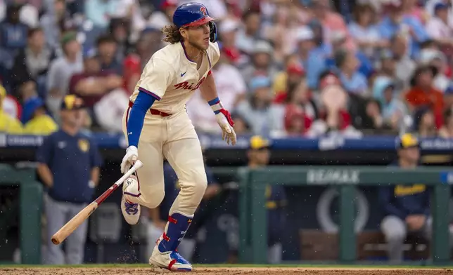 Philadelphia Phillies' Alec Bohm watches his solo home run during the fourth inning of a baseball game against the Milwaukee Brewers, Saturday, May 31, 2025, in Philadelphia. (AP Photo/Chris Szagola)