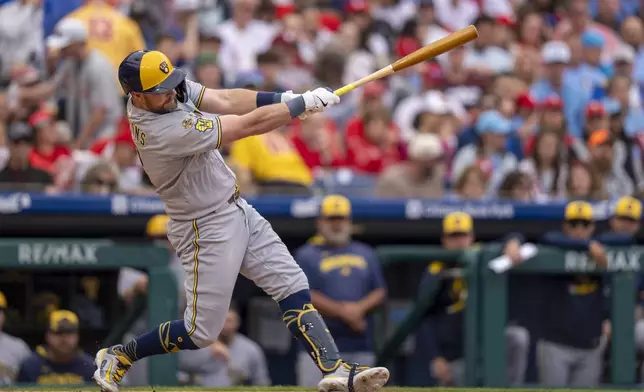Milwaukee Brewers' Rhys Hoskins hits a three-run home run during the fourth inning of a baseball game against the Philadelphia Phillies, Saturday, May 31, 2025, in Philadelphia. (AP Photo/Chris Szagola)