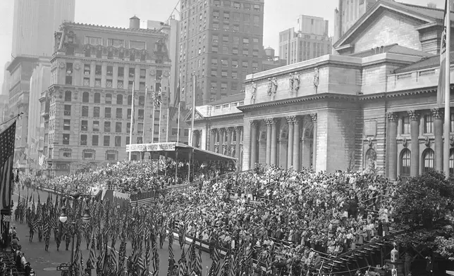 FILE - Almost 2 million people packed Fifth Avenue and side streets to witness New York's "At War Parade" June 13, 1942, in New York. (AP Photo)