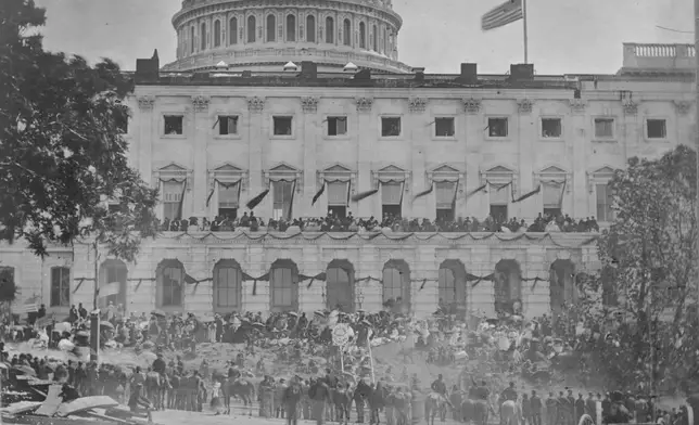 People watch from the U.S. Capitol, during the grand review of the great veteran armies of Grant and Sherman on May 23-24, 1865, in Washington. (Matthew Brady/Library of Congress via AP)