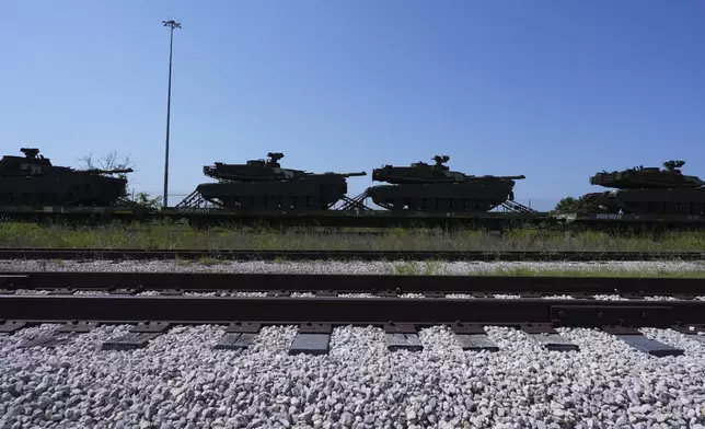 Military tanks and other military vehicles are transported via railroad to Washington, D.C. for an upcoming parade for the Army's 250th anniversary, Monday, June 2, 2025, at Fort Cavazos near Killeen, Texas. (AP Photo/Eric Gay)