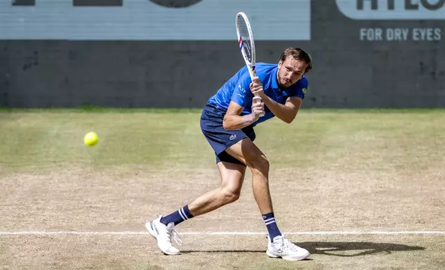 Russia's Daniil Medvedev returns the ball to Kazakhstan's Alexander Bublik during their men's single final of the Halle tennis tournament, Germany, Sunday, June 22, 2025. (David Inderlied/dpa via AP)