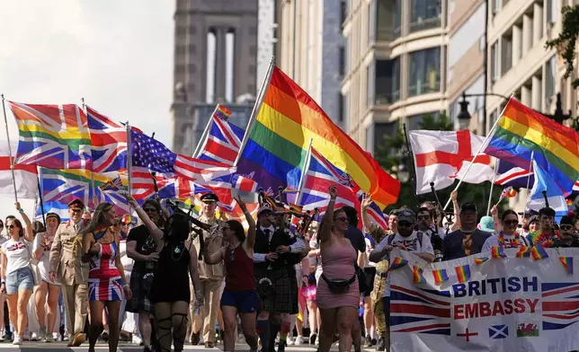 Representatives of the British embassy march during the World Pride Parade, Saturday, June 7, 2025, in Washington. (AP Photo/Mark Schiefelbein)