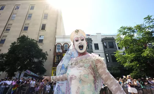 A person marches during the World Pride parade, Saturday, June 7, 2025, in Washington. (AP Photo/Alex Brandon)