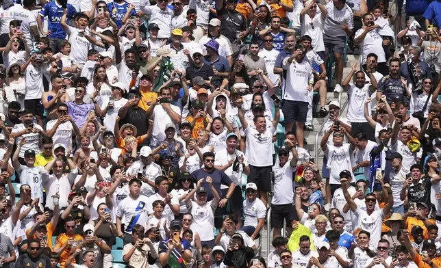 Fans cheer after the opening goal during the Club World Cup group H soccer match between Real Madrid and Al Hilal in Miami Gardens, Fla., Wednesday, June 18, 2025. (AP Photo/Rebecca Blackwell)