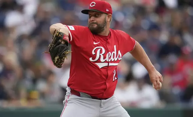 Cincinnati Reds' Wade Miley pitches in the first inning of a baseball game against the Cleveland Guardians in Cleveland, Monday, June 9, 2025. (AP Photo/Sue Ogrocki)