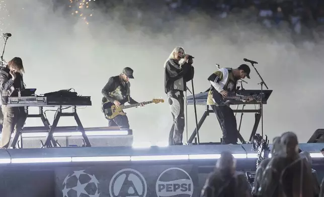 Linkin Park performs before the Champions League final soccer match between Paris Saint-Germain and Inter Milan at the Allianz Arena in Munich, Germany, Saturday, May 31, 2025. (AP Photo/Alexandra Beier)