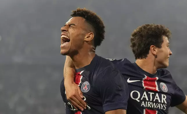 PSG's Desire Doue celebrates after scoring his side's second goal during the Champions League final soccer match between Paris Saint-Germain and Inter Milan at the Allianz Arena in Munich, Germany, Saturday, May 31, 2025. (AP Photo/Matthias Schrader)