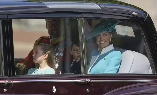 Kate, Princess of Wales and her daughter Princess Charlotte arrive by car to take part in the Trooping the Color in London, Saturday, June 14, 2025, also in the car is Prince William at rear and Prince Louis. (AP Photo/Alberto Pezzali)