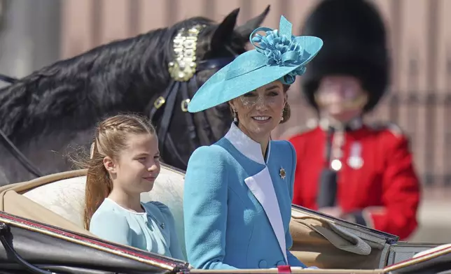 Kate Princess of Wales with her daughter Princess Charlotte travel in a carriage along the Mall to the Trooping of Colour in London, Saturday, June 14, 2025. (AP Photo/Alberto Pezzali)