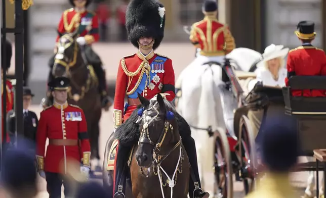 Prince William takes part in the Trooping the Colour in London, Saturday, June 14, 2025, the prince is wearing a black armband as a mark of respect to the victims of the Air India plane crash. (AP Photo/Alberto Pezzali)