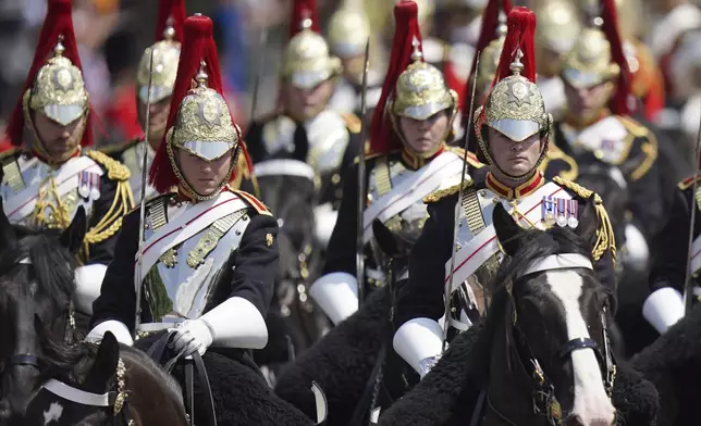 Members of the Blues and Royals Household cavalry tale part in the Trooping the Colour in London, Saturday, June 14, 2025. (AP Photo/Alberto Pezzali)