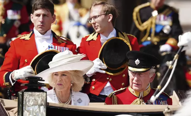 Britain's King Charles III and Queen Camilla leave Buckingham Palace ahead of Trooping of Trooping the Colour, the king's annual birthday parade, in London, Saturday June 14, 2025. (Aaron Chown/PA via AP)