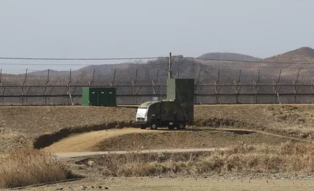 FILE - A South Korean military vehicle with loudspeakers is seen in front of the barbed-wire fence in Paju, near the border with North Korea, on Feb. 15, 2018.(AP Photo/Ahn Young-joon, File)