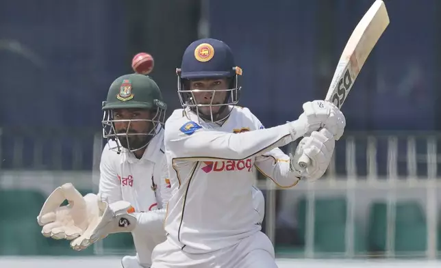 Sri Lanka's Pathum Nissanka hits a boundary during the second day of the second cricket test match between Sri Lanka and Bangladesh in Colombo, Sri Lanka, Thursday, June 26, 2025. (AP Photo/Eranga Jayawardena)